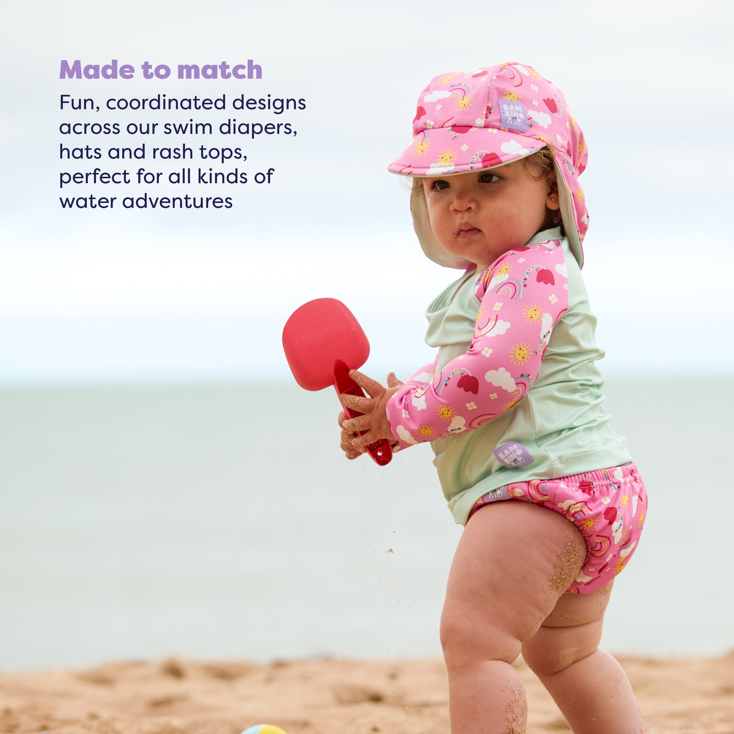 UPF 40+ Reversible Swim Hat for Babies and Toddlers in Happy Days - Bambino Mio (EU)