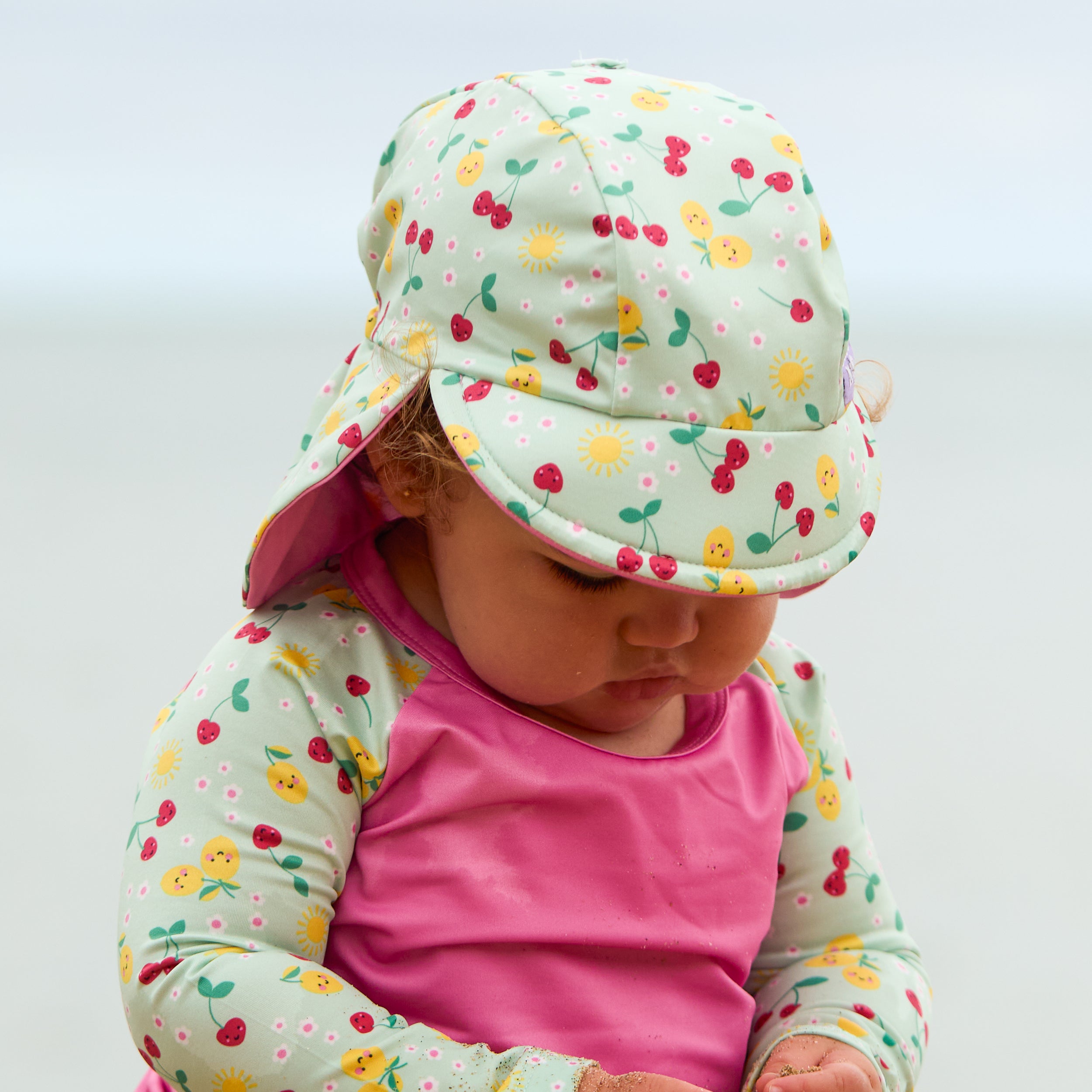 UPF 40+ Reversible Swim Hat for Babies and Toddlers in Juicy Fruit - Bambino Mio (EU)