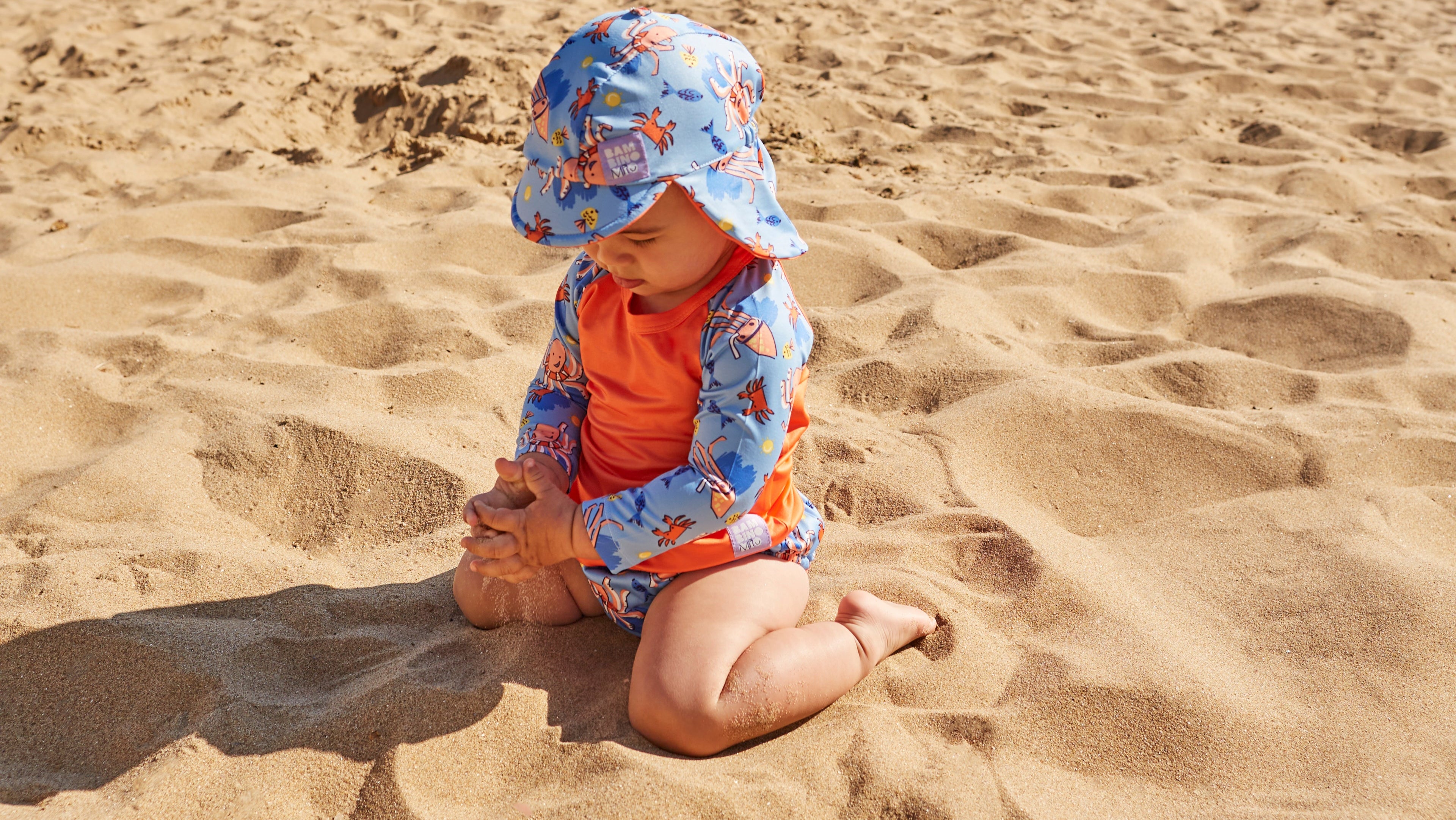 UPF 40+ Reversible Swim Hat for Babies and Toddlers in Nautical - Bambino Mio (EU)