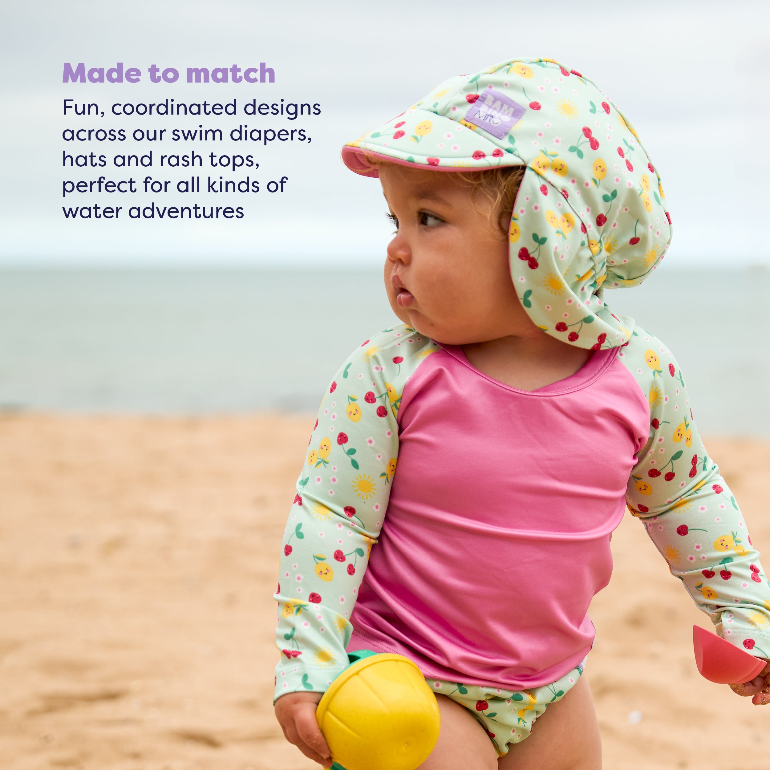 UPF 40+ Reversible Swim Hat for Babies and Toddlers in Juicy Fruit - Bambino Mio (EU)