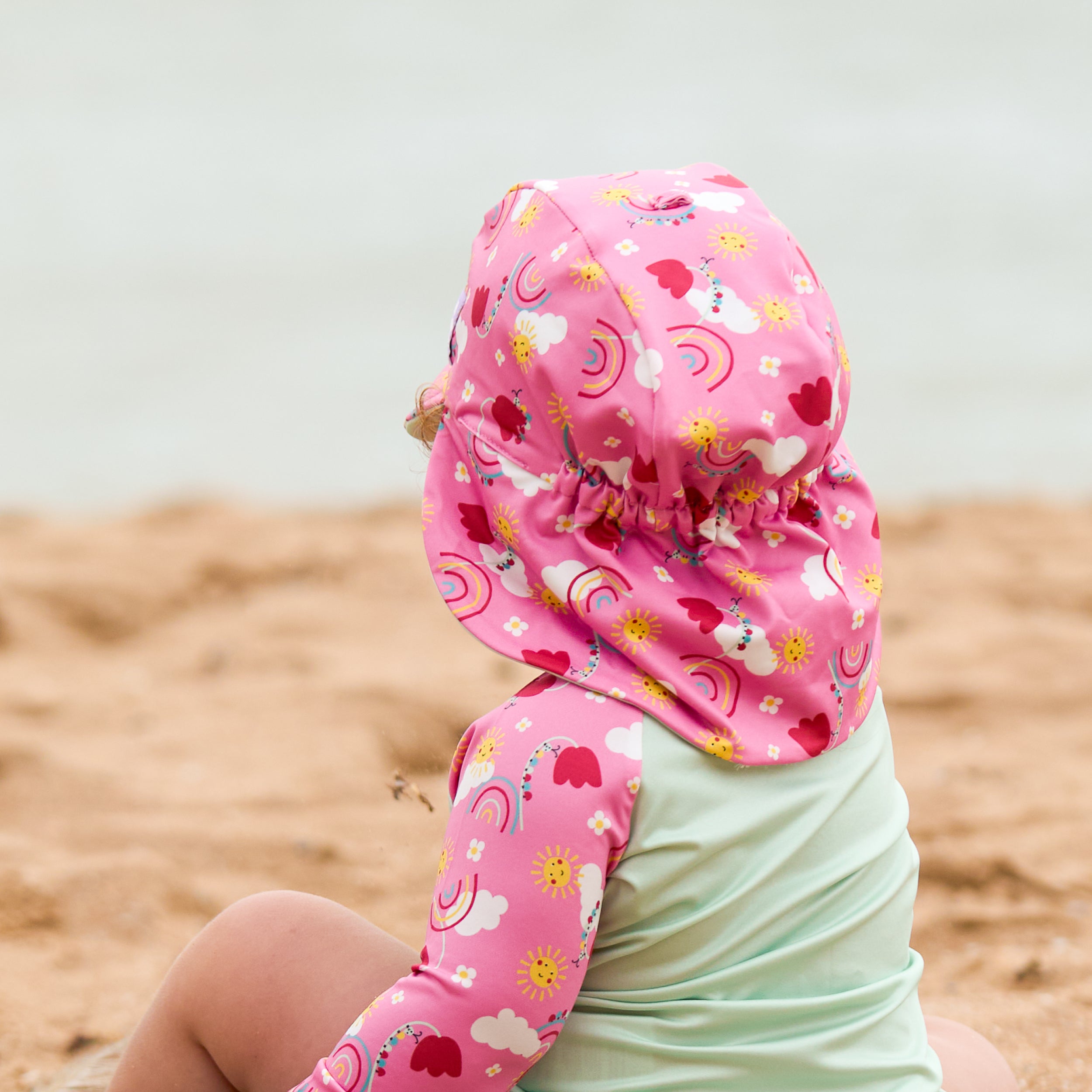 UPF 40+ Reversible Swim Hat for Babies and Toddlers in Happy Days - Bambino Mio (EU)